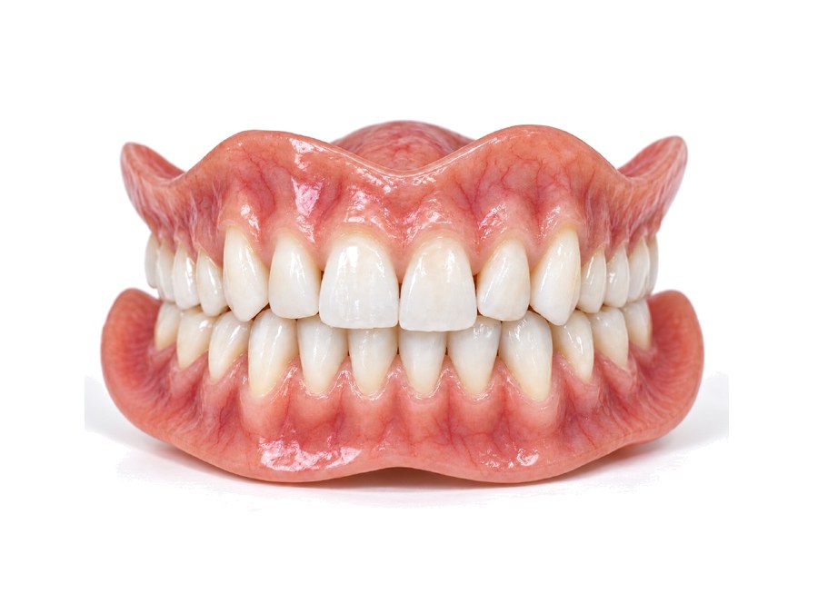 An Aesthetic full denture, upper and lower together: a lifelike gum with fine vein detail and layered, subtly translucent teeth.