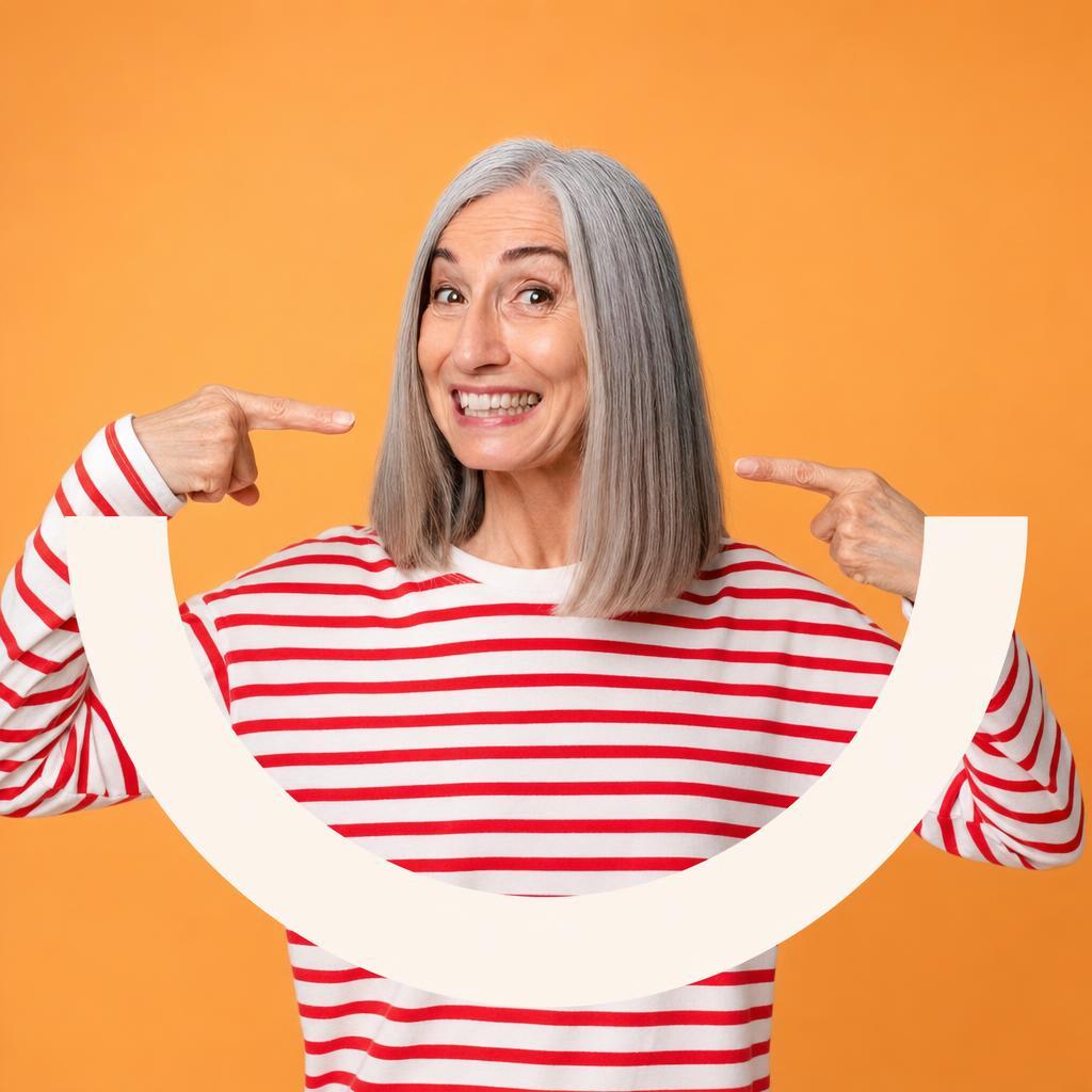 A smiling older woman pointing to her smile, with the Happy Dentures smile drawn across the picture