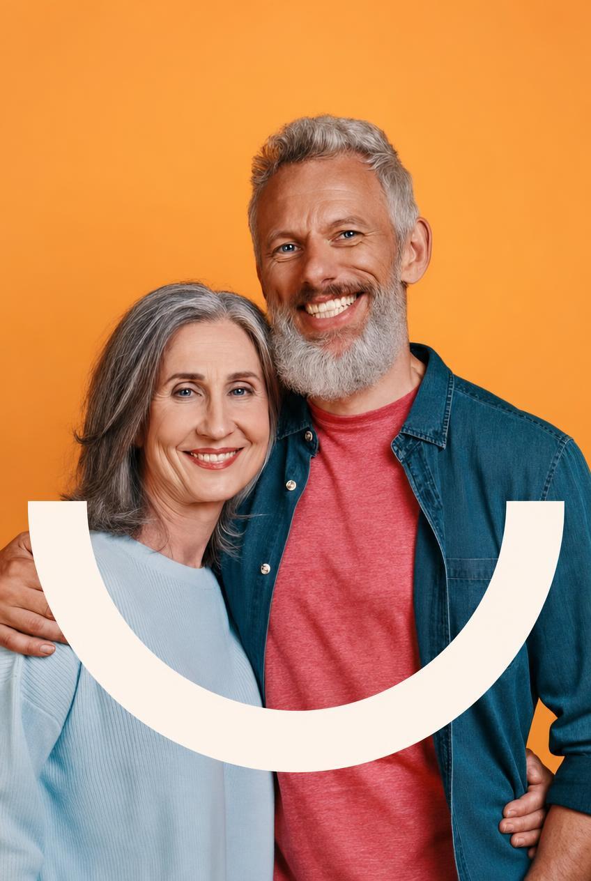 A smiling older couple, with the Happy Dentures smile drawn across the picture