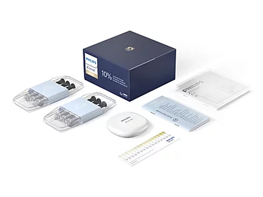 A Philips Zoom whitening kit: the box, two packs of gel syringes, a tray case, the instructions and a shade guide.